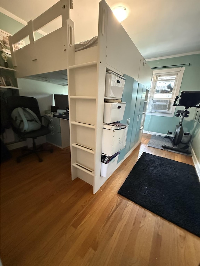 62-23 69th Pl, Middle Village, NY 11379 - interior space featuring wood finished floors, cooling unit, baseboards, and crown molding