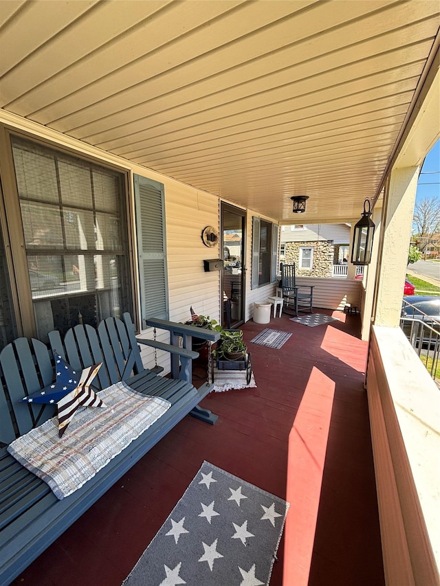 wooden terrace featuring a porch