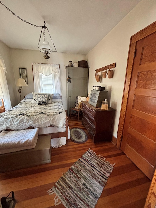 bedroom featuring wood finished floors