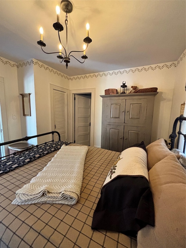 bedroom with a notable chandelier