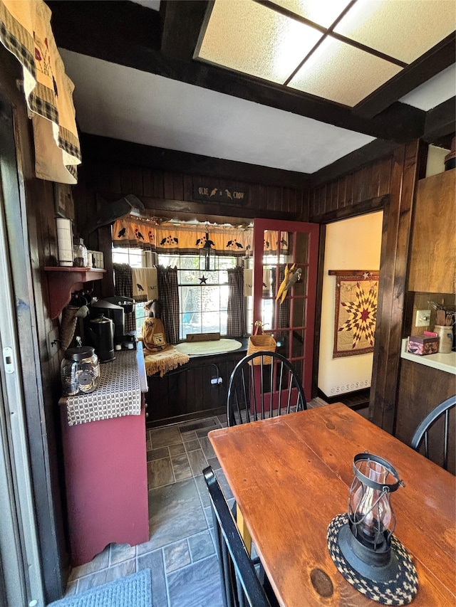 dining area with wooden walls
