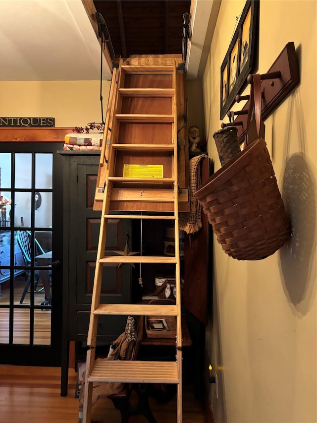 stairway with wood finished floors