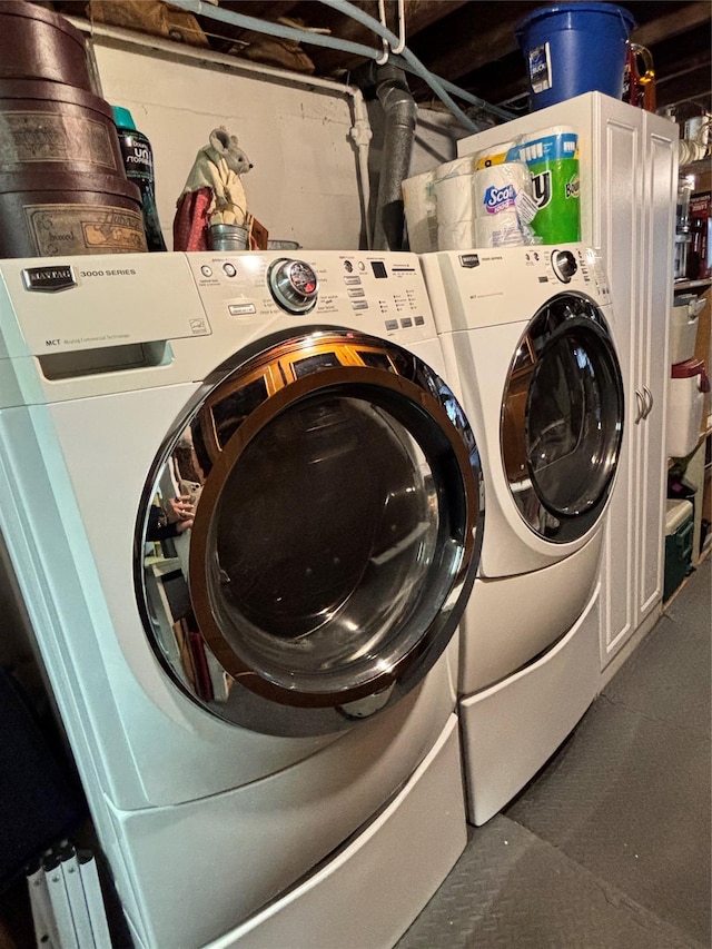 clothes washing area featuring laundry area and independent washer and dryer