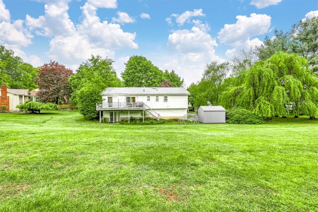 12 Jay Ct, Monsey, NY 10952 - rear view of property with a storage shed, a wooden deck, an outdoor structure, and a lawn