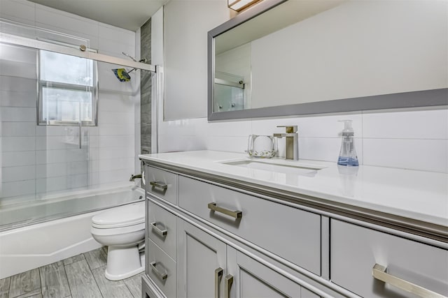 12 Jay Ct, Monsey, NY 10952 - bathroom with toilet, vanity, and bath / shower combo with glass door
