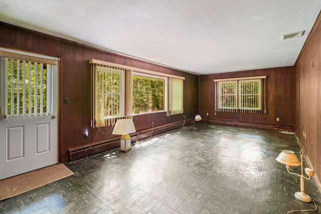 65 Preston St, Huntington, NY 11743 - entryway featuring wooden walls, baseboard heating, and tile patterned floors