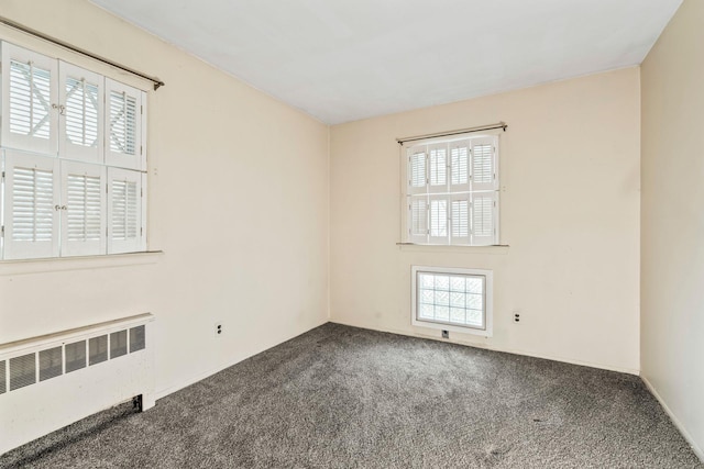 65 Preston St, Huntington, NY 11743 - spare room with radiator and carpet floors