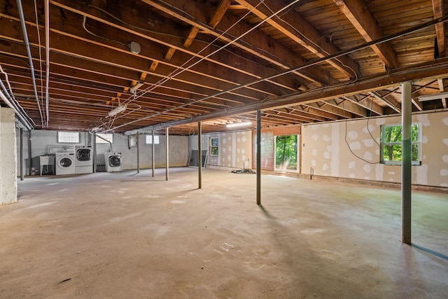 65 Preston St, Huntington, NY 11743 - below grade area featuring washing machine and clothes dryer