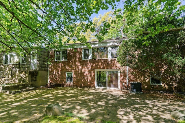 65 Preston St, Huntington, NY 11743 - back of house featuring brick siding