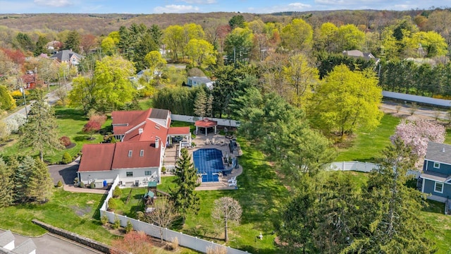 drone / aerial view featuring a forest view
