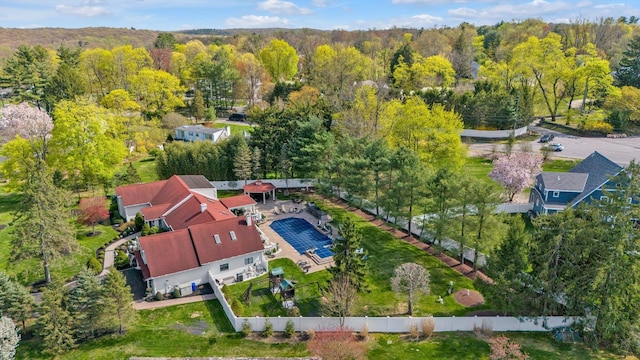 birds eye view of property with a forest view