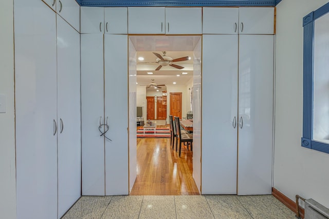 corridor featuring recessed lighting and baseboards
