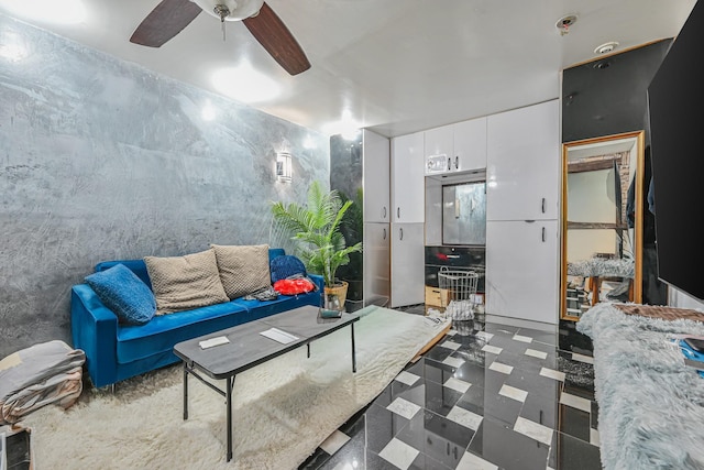 living area featuring ceiling fan
