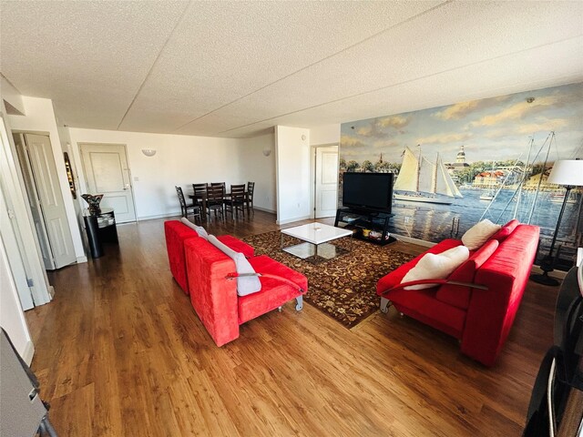 136 Bch 117th St Unit 410, Rockaway Park, NY 11694 - living room with a textured ceiling and wood finished floors