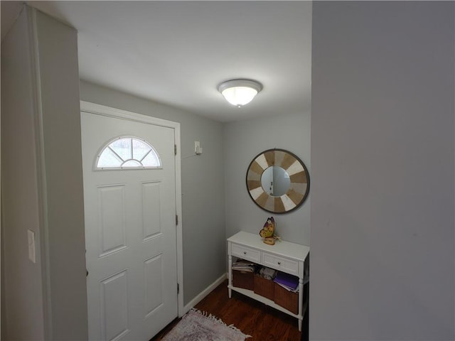 entryway with baseboards and dark wood finished floors