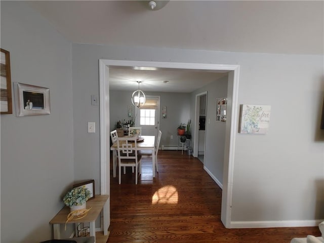 hall featuring baseboards, dark wood finished floors, and baseboard heating
