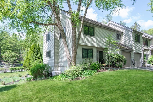 201 Hunters Run, Dobbs Ferry, NY 10522 - rear view of house with a yard and a garage