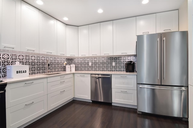 201 Hunters Run, Dobbs Ferry, NY 10522 - kitchen featuring appliances with stainless steel finishes, white cabinetry, recessed lighting, dark wood-type flooring, and tasteful backsplash