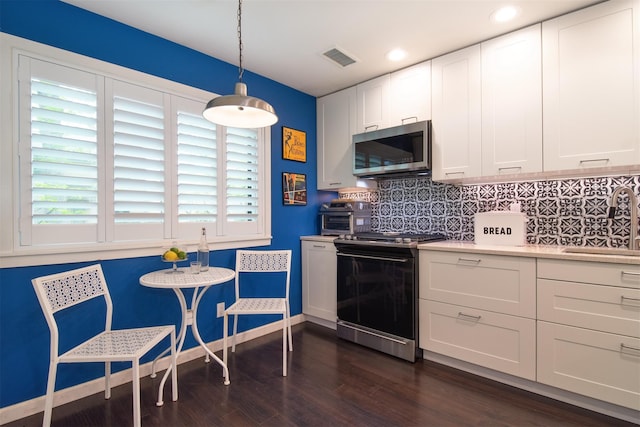 201 Hunters Run, Dobbs Ferry, NY 10522 - kitchen with stainless steel microwave, range with electric cooktop, a sink, plenty of natural light, and recessed lighting