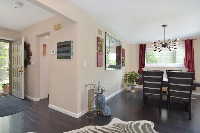 201 Hunters Run, Dobbs Ferry, NY 10522 - foyer entrance featuring a chandelier, healthy amount of natural light, wood finished floors, and baseboards