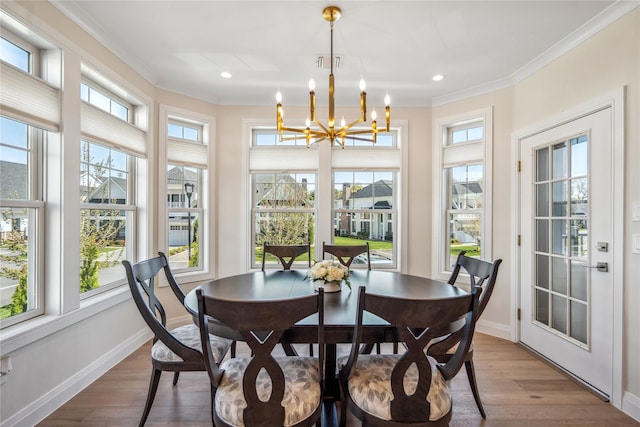 20105 Aspenwood Dr, Plainview, NY 11803 - dining space featuring a chandelier, crown molding, baseboards, wood finished floors, and recessed lighting