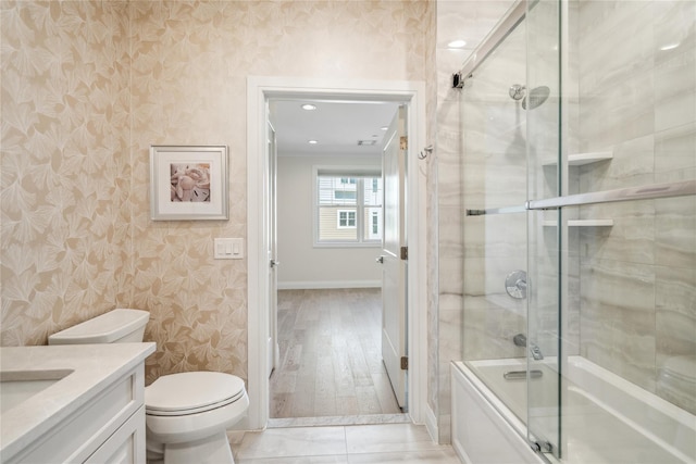 20105 Aspenwood Dr, Plainview, NY 11803 - full bathroom featuring wallpapered walls, shower / bath combination with glass door, baseboards, vanity, and toilet