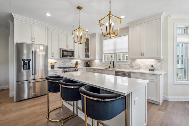 20105 Aspenwood Dr, Plainview, NY 11803 - kitchen with stainless steel appliances, a sink, light countertops, white cabinets, and recessed lighting