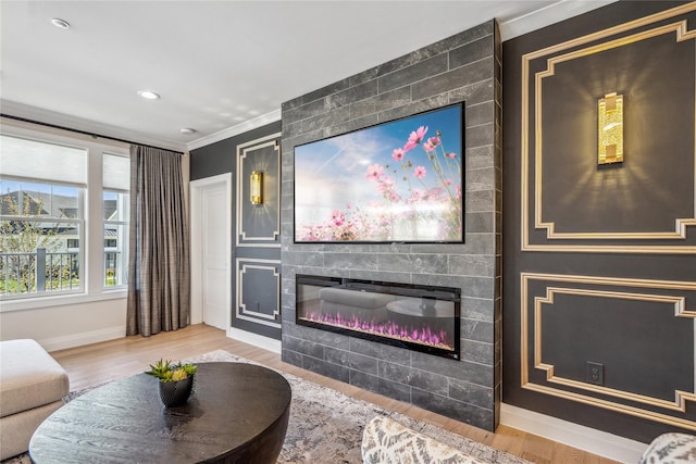 20105 Aspenwood Dr, Plainview, NY 11803 - living area featuring a large fireplace, baseboards, wood finished floors, and crown molding
