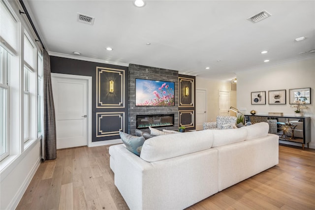 20105 Aspenwood Dr, Plainview, NY 11803 - living room featuring ornamental molding, a fireplace, light wood finished floors, recessed lighting, and baseboards