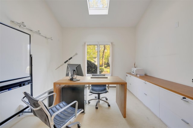 office with vaulted ceiling with skylight