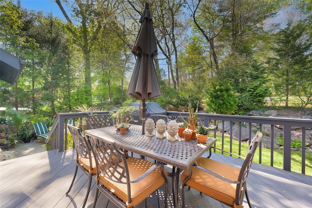 wooden terrace featuring outdoor dining space