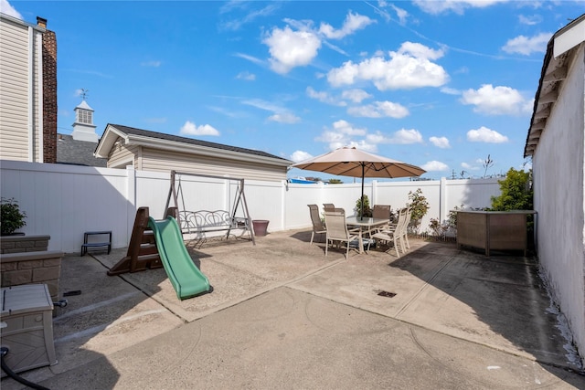 487 Emerson Pl, Valley Stream, NY 11580 - view of patio featuring outdoor dining area and a fenced backyard