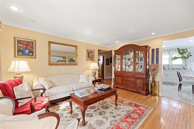 487 Emerson Pl, Valley Stream, NY 11580 - living room featuring recessed lighting, ornamental molding, and light wood-type flooring