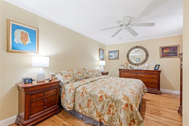 487 Emerson Pl, Valley Stream, NY 11580 - bedroom featuring crown molding, a ceiling fan, baseboards, and light wood-style flooring