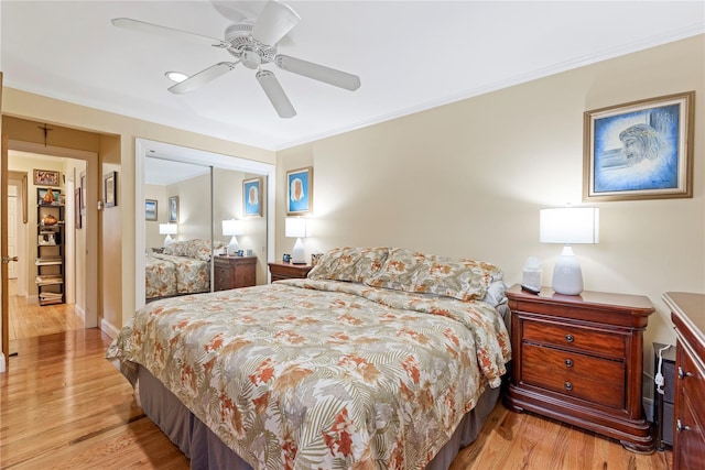 487 Emerson Pl, Valley Stream, NY 11580 - bedroom featuring crown molding, ceiling fan, light wood-style flooring, and a closet