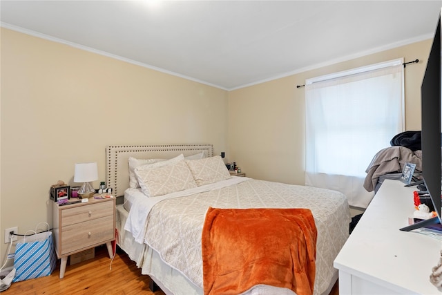 487 Emerson Pl, Valley Stream, NY 11580 - bedroom with crown molding and light wood finished floors