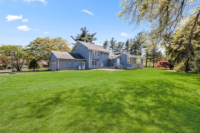rear view of house with a lawn