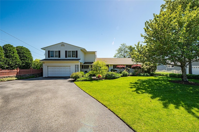 137 Melbury Rd, Babylon, NY 11702 - traditional home with driveway, a garage, and stucco siding