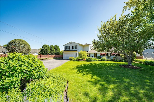 137 Melbury Rd, Babylon, NY 11702 - view of front of property with driveway, a garage, and stucco siding