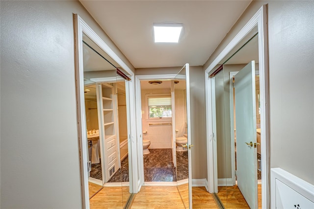 137 Melbury Rd, Babylon, NY 11702 - hallway featuring light wood-style flooring