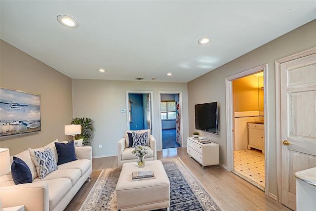 137 Melbury Rd, Babylon, NY 11702 - living room with light wood-style flooring and recessed lighting