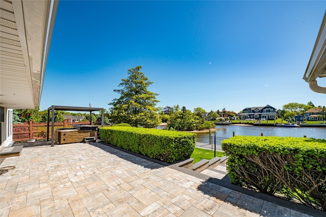137 Melbury Rd, Babylon, NY 11702 - view of patio featuring a water view and exterior kitchen