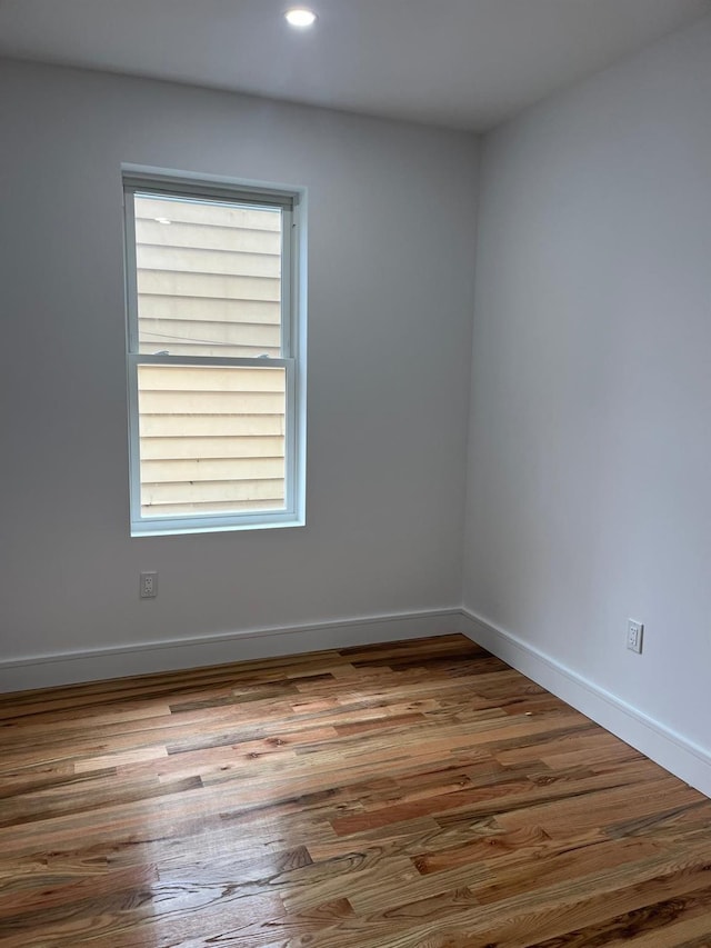 53-12 103rd St, Corona, NY 11368 - empty room with wood finished floors, baseboards, and recessed lighting