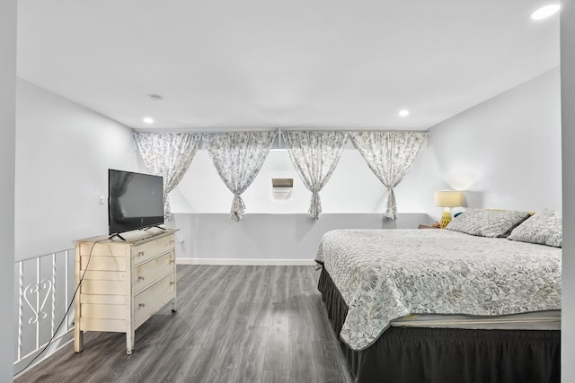 bedroom featuring baseboards, recessed lighting, and wood finished floors
