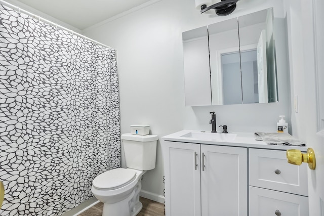 full bath featuring vanity, ornamental molding, toilet, and curtained shower