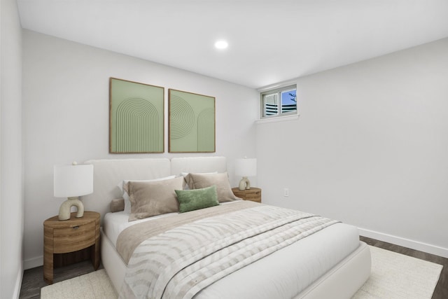 bedroom with recessed lighting, baseboards, and wood finished floors