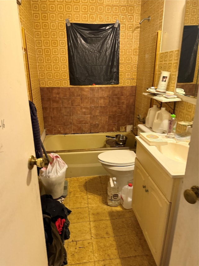 full bath with vanity, toilet, and  shower combination
