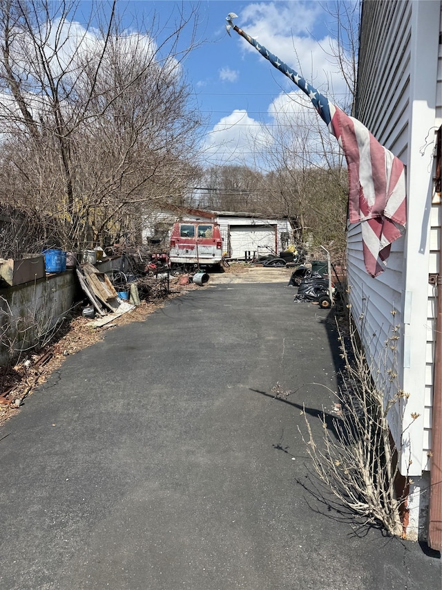 view of road with aphalt driveway