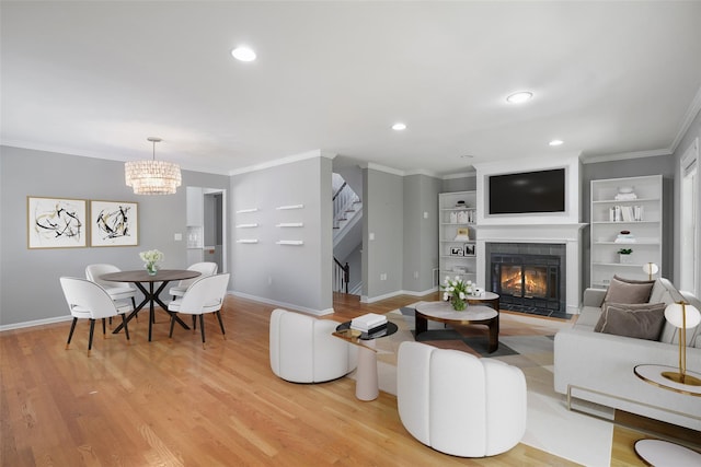 149 King St Unit 15, Chappaqua, NY 10514 - living area featuring a tile fireplace, stairway, baseboards, recessed lighting, and light wood-type flooring