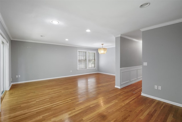 149 King St Unit 15, Chappaqua, NY 10514 - empty room featuring crown molding, light wood finished floors, a chandelier, recessed lighting, and baseboards